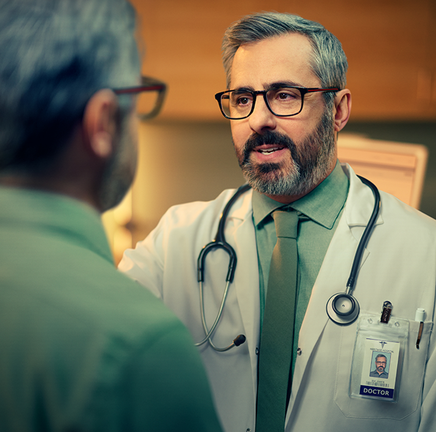 Doctor in white lab coat talking to patient